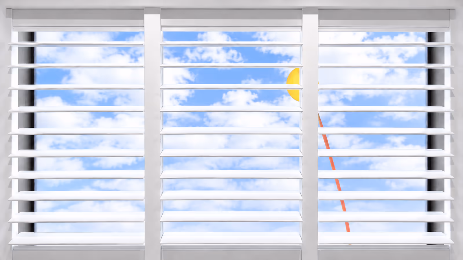 Bright white custom plantation shutters tilted open to a blue, cloud-dotted sky, installed by La Grange Window Coverings in Sonoma County