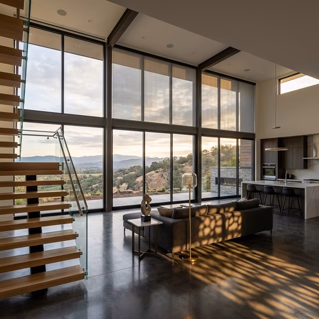 La Grange Window Coverings Somfy motorized solar shades with sub-35 dBA operation on floor-to-ceiling architectural glass in a rebuilt Fountaingrove contemporary estate, Santa Rosa CA 95404